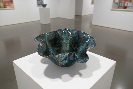 Ceramic dish with textured surface on a wooden surface