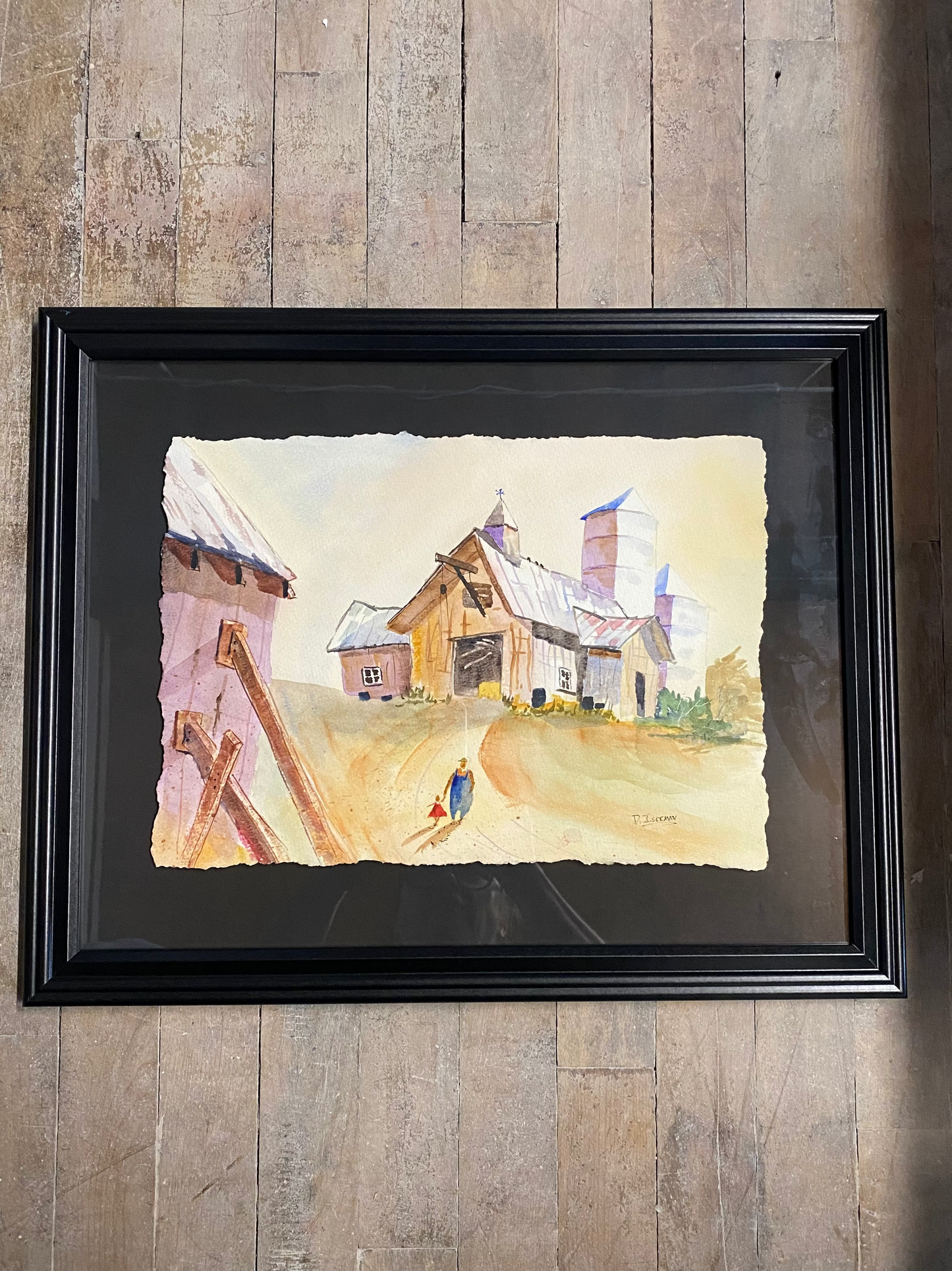 Framed artwork on a wooden wall