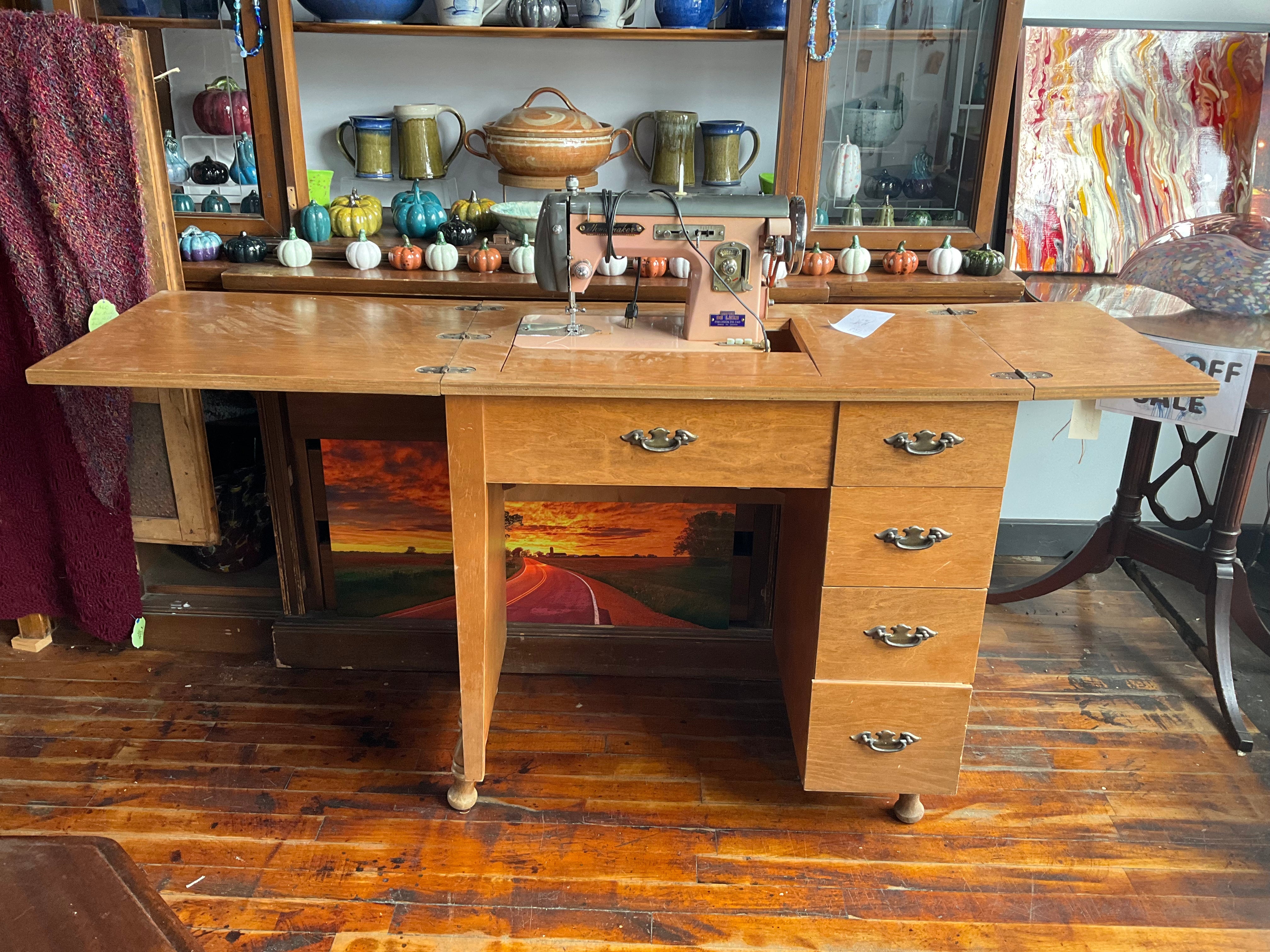 Antique sewing machine and shops cabinet